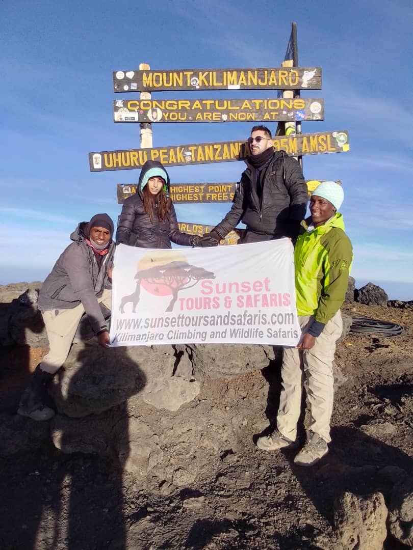 Sunset Tours Banner At Uhuru Peak Kilimanjaro Summit Team
