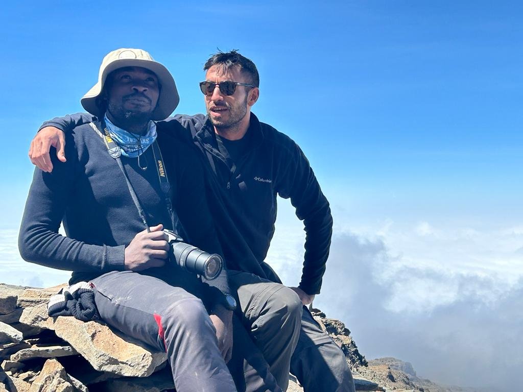 Sunset Tours Guide And Trekker Above Clouds Mountain View